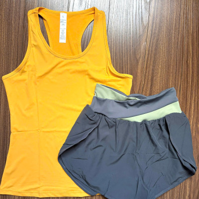 Bộ đồ thể thao nữ gồm áo ba lỗ khoét lưng và quần đùi 2 lớp hàng Quảng Châu cao cấp